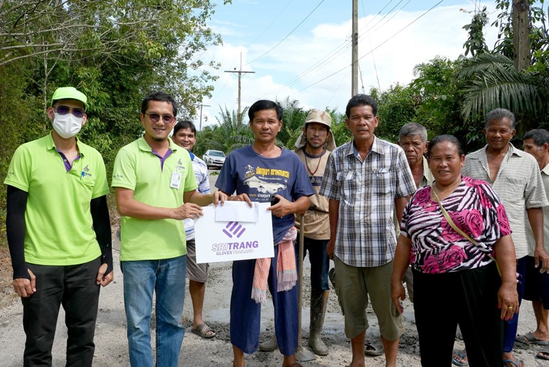 Sri Trang Gloves (STGT), organized the road maintenance project
